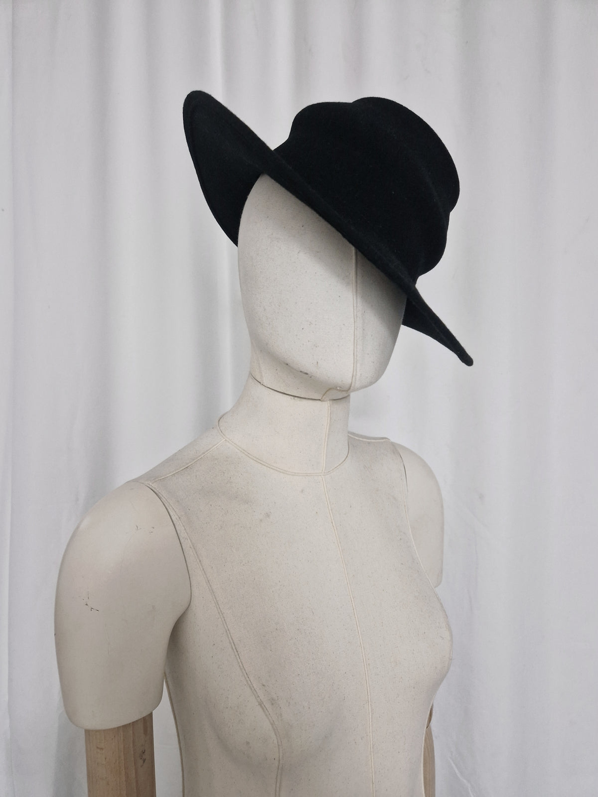 Asymmetric wool felt hat made by combining two of our hat blocks